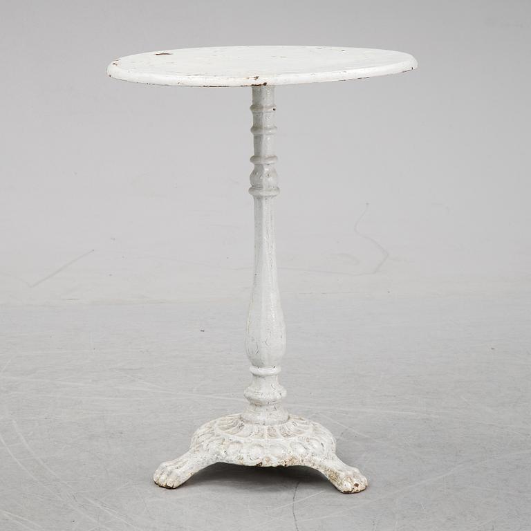 A cast iron garden table, early 20th century.