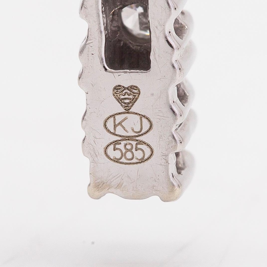 Necklace/pendant, cross, 14K white gold with diamonds totalling approx. 0.25 ct. Finnish hallmarks.