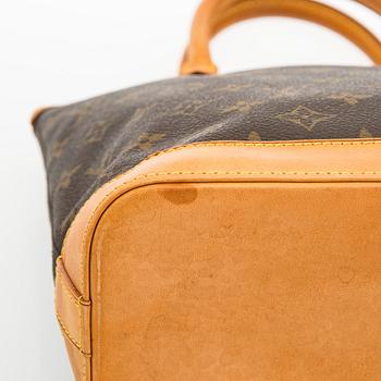 Louis Vuitton, a 'Lockit PM' bag.