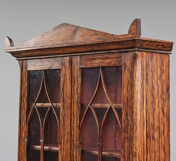 A Swedish faux-boix neo-gothic book cabinet, ca 1830.
