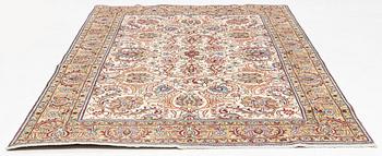A Tabriz carpet, 309 x 205 cm.