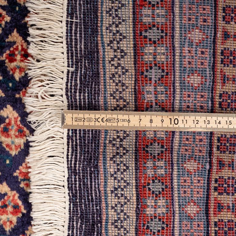 A carpet, Sarouk-mir, 372 x 260 cm.