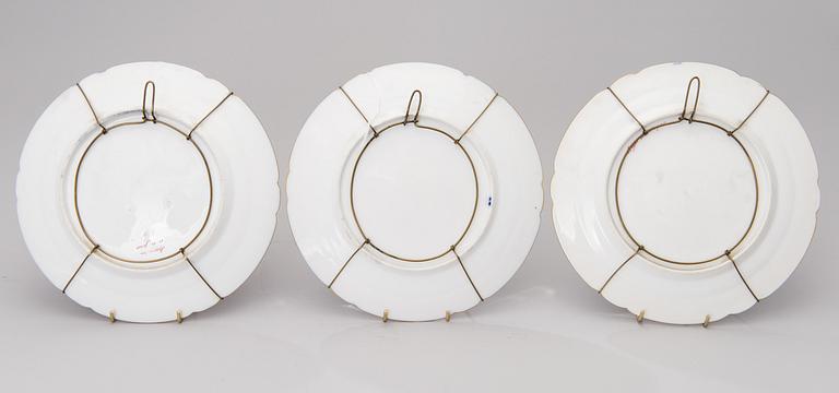 A set of 3 French porcelain decorative plates from the latter half of the 19th century.