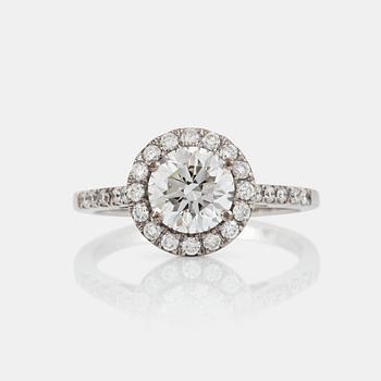 1304. A brilliant-cut diamond ring. Center stone 1.50 cts F/IF according to IGI cert, surrounded by 0.36 ct pavé-set diamonds.