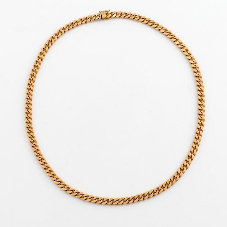 18K gold curb link necklace.