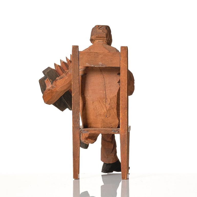 Axel Petersson Döderhultarn, Seated accordionist.