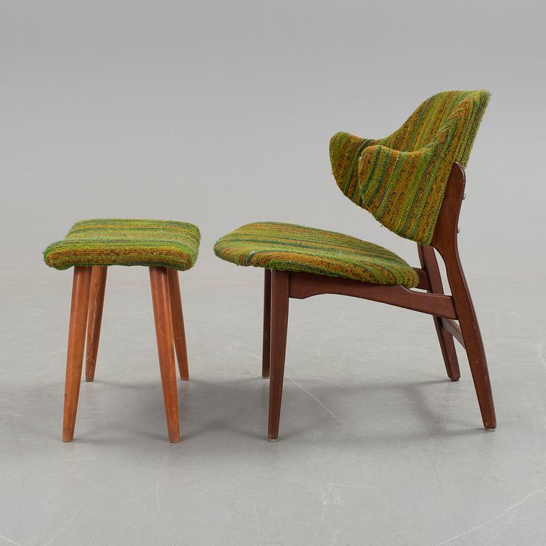 An IKEA armchair with a stool.