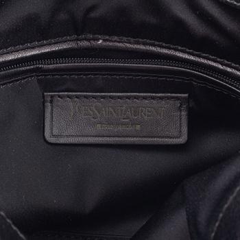 Yves Saint Laurent, a black leather bow bag.