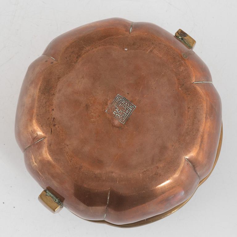 A Chinese copper handwarmer, late Qing dynasty.