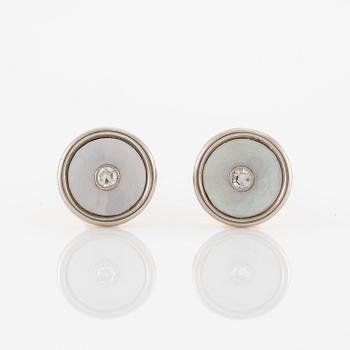C.G Hallberg, cufflinks and shirt studs, two pairs, 18K gold with diamonds and mother-of-pearl.