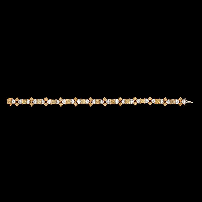A Fancy Yellow and colourless diamond, total carat weight 23.16 cts, bracelet.