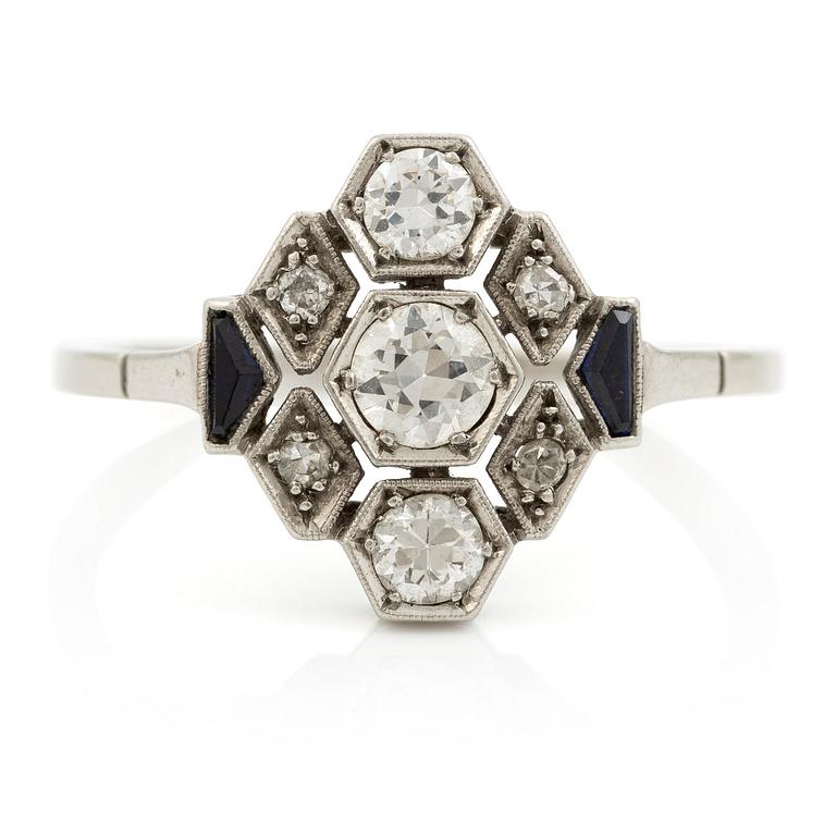 A platinum ring set with round brilliant-cut diamonds and sapphires, Art Déco.
