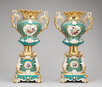 A pair of large french vases on stands, Jacob Petit, mid 19th Century.