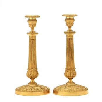 A pair of Empire early 19th century candlesticks.