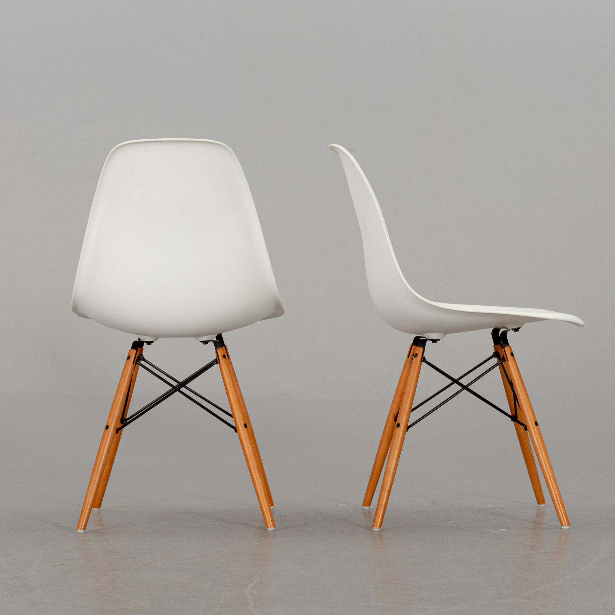 A PAIR OF "PLASTIC CHAIR" BY CHARLES & RAY EAMES, Vitra 2009.