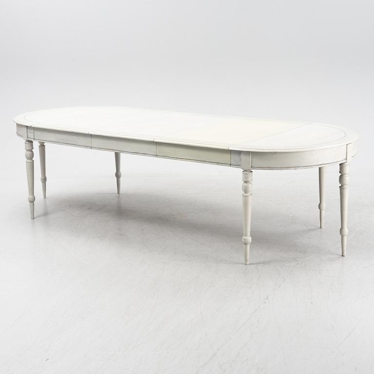A painted dining table, 20th Century.