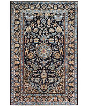 A Kashmar rug, part silk, c. 234 x 142 cm.
