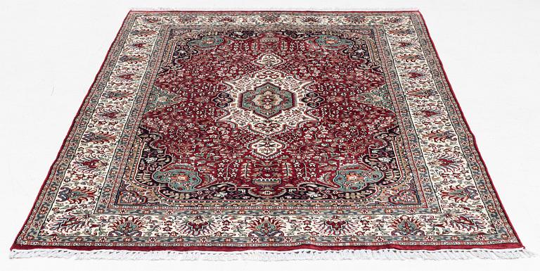 An oriental synthetic silk rug, c 145 x 215 cm.
