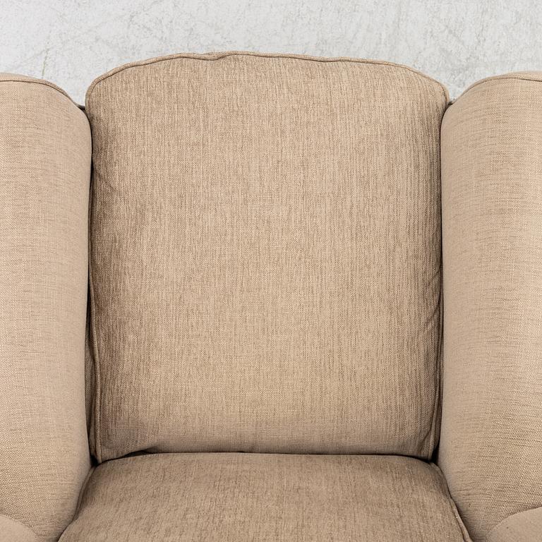 An armchair with footstool, Howard model, Englessons, 21st century.