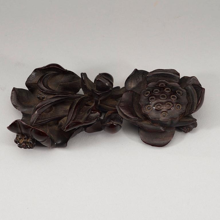 A finely carved Zitan "Lotus" stand, Qing Dynasty (1644-1912).