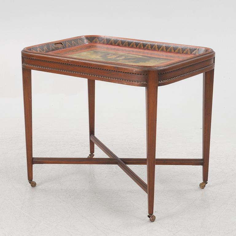 A painted tin tray 19th century with later stand.