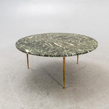 A marble coffee table alter part of the 20th century.