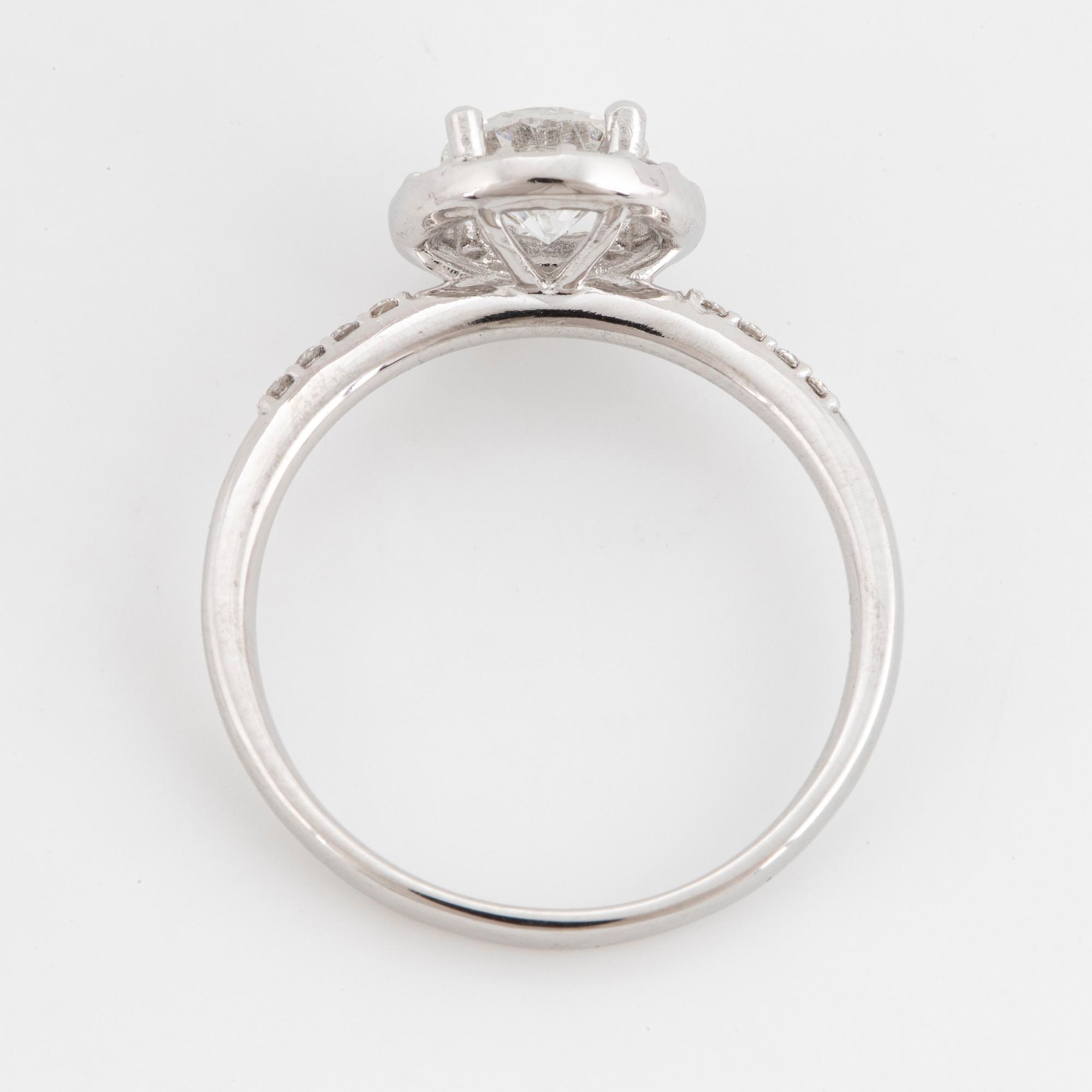 Brilliant-cut diamond halo ring.