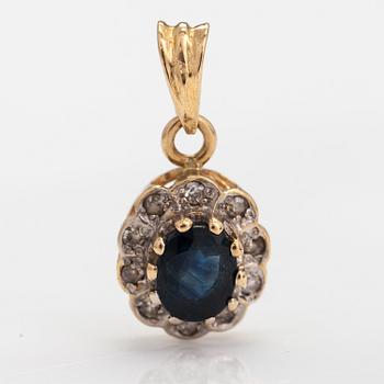 A 14K gold penadant with a sapphire and diamonds ca. 0.025 ct in total.