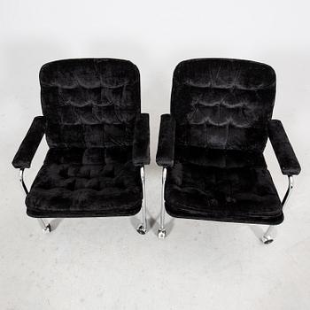 A pair of chrome and fabric 1970/80s armchairs.