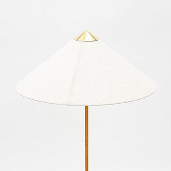 Paavo Tynell, A model 9602 brass and rattan floor lamp with canvas shade from Gubi,