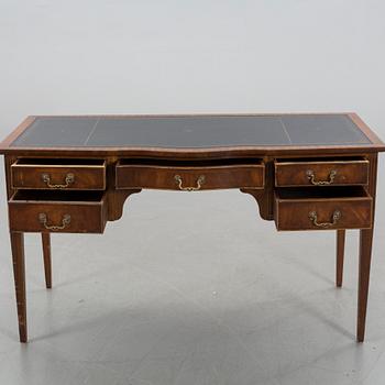 A Reprodux English writing desk.