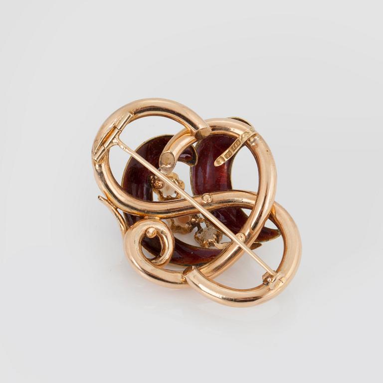 BROSCH/HÄNGE med tre mabépärlor samt blå och röd emalj.