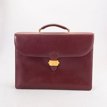 A Cartier leather briefcase.