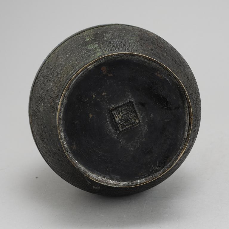 A Chinese bronze and cloisonné vase, around the year 1900.