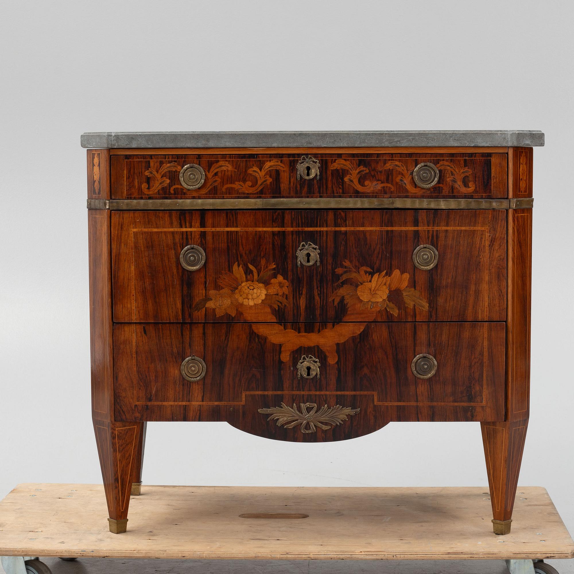 A Gustavian style chest of drawers, early 20th century.