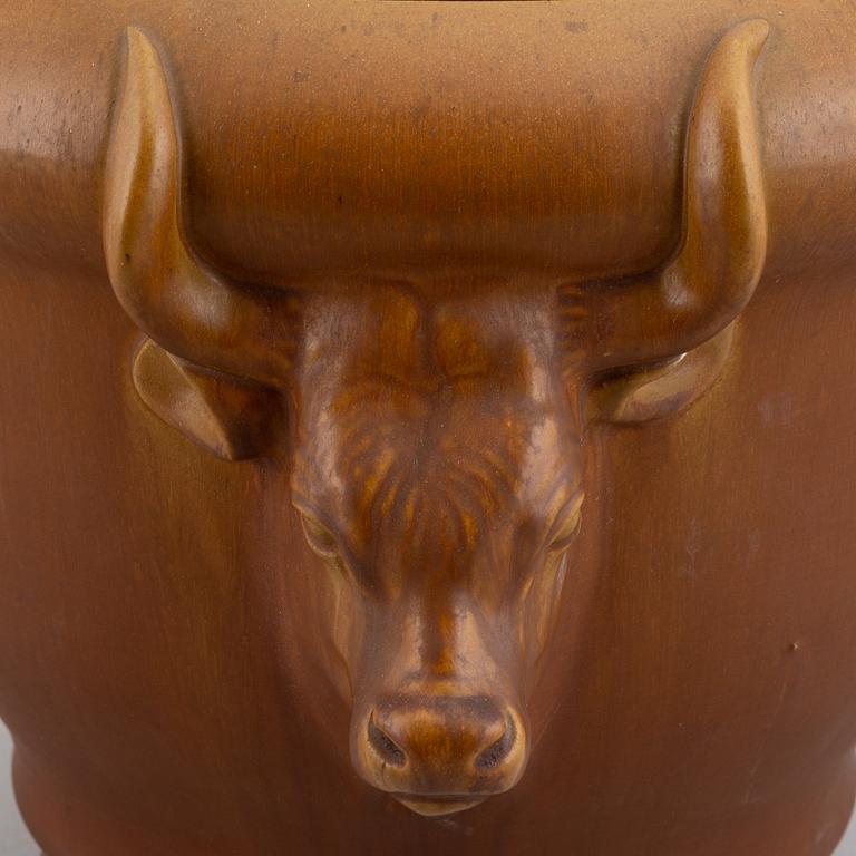 An earthenware pot decorated with four bulls heads. Probably by Karl Hansen Reistrup for Herman Kähler. Around 1900.