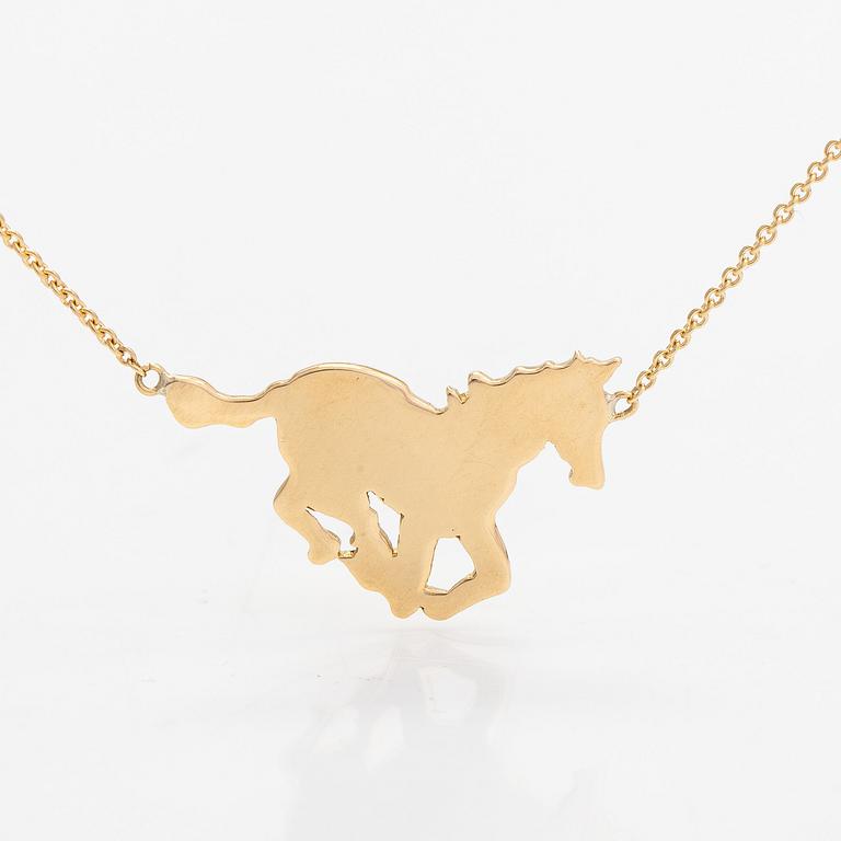 An 18K gold horse necklace. Tillander, Helsinki.