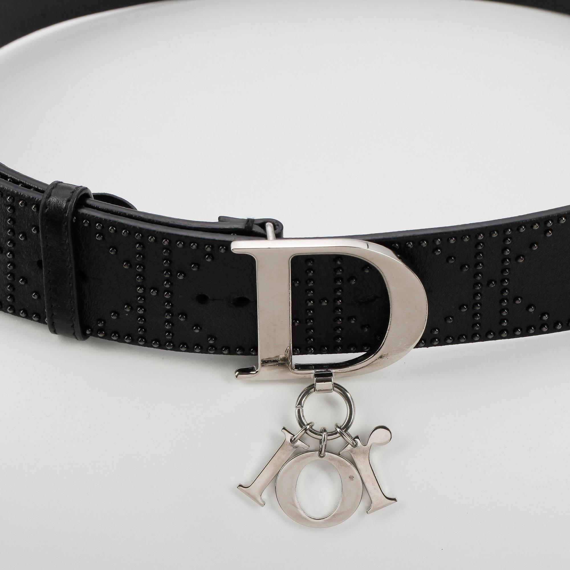 CHRISTIAN DIOR, a black leather belt.