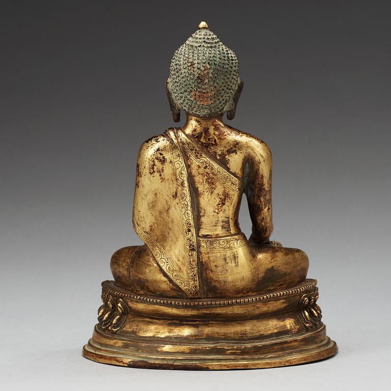 A seated bronze Akshobhya Buddha, late Qing dynasty.