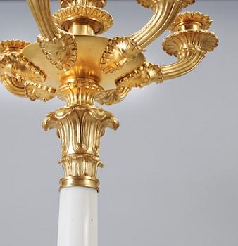 A pair of Empire-style circa 1900 seven-light candelabra.
