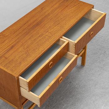 A 1950's/60's teak veneered chest of drawers.