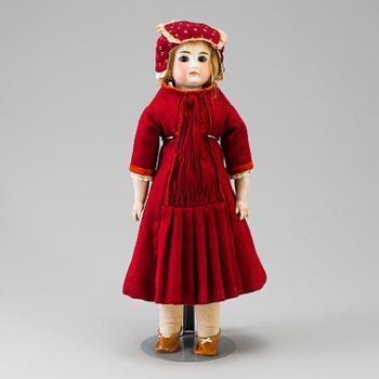 A bisque head doll, possibly France, late 19th century.
