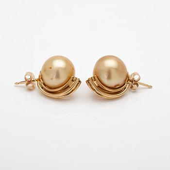 18K gold earrings with South Sea pearls and diamonds.