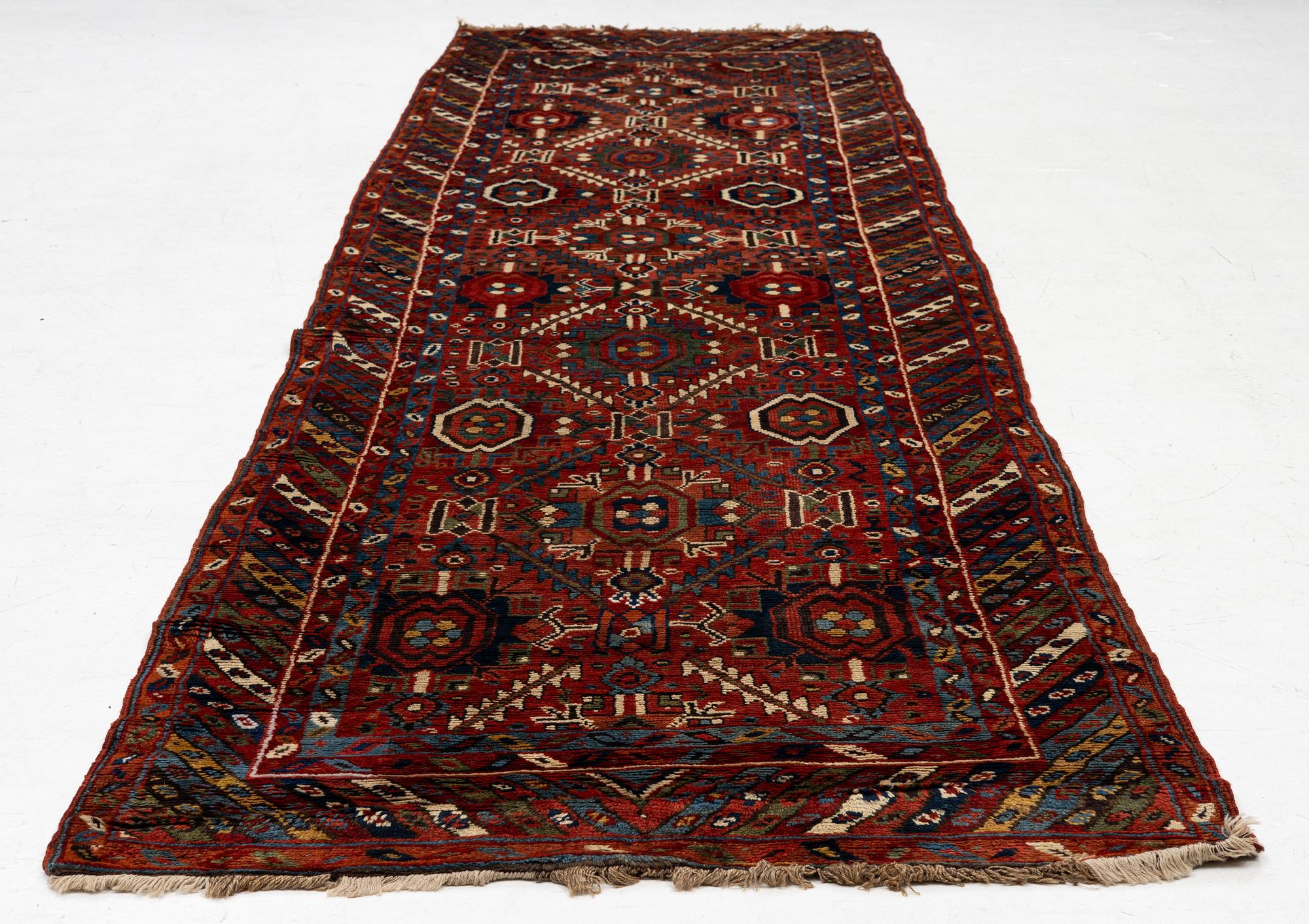 An antique Sauj Bulag runner, Eastern Kurdistan, c. 360 x 155.