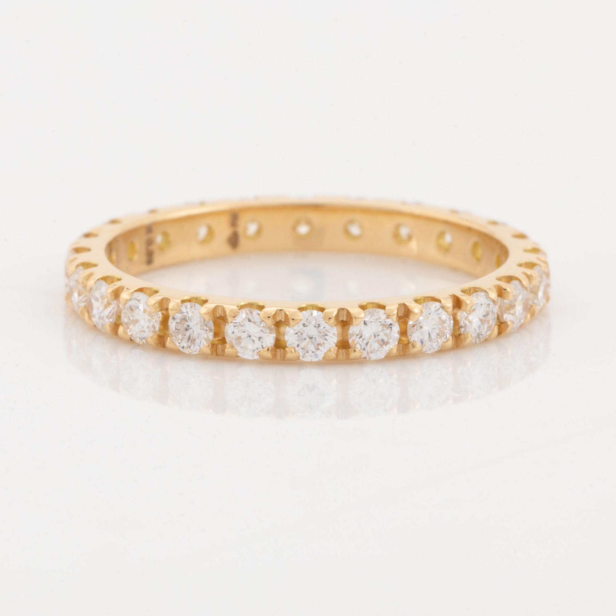Brilliant cut diamond eternity ring.