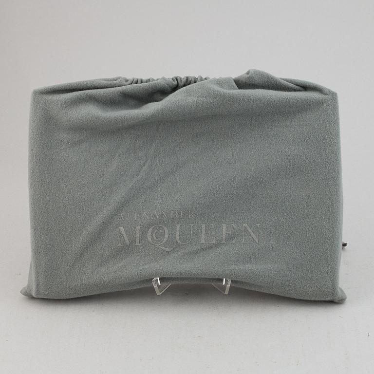 Alexander McQueen, a fabric clutch.