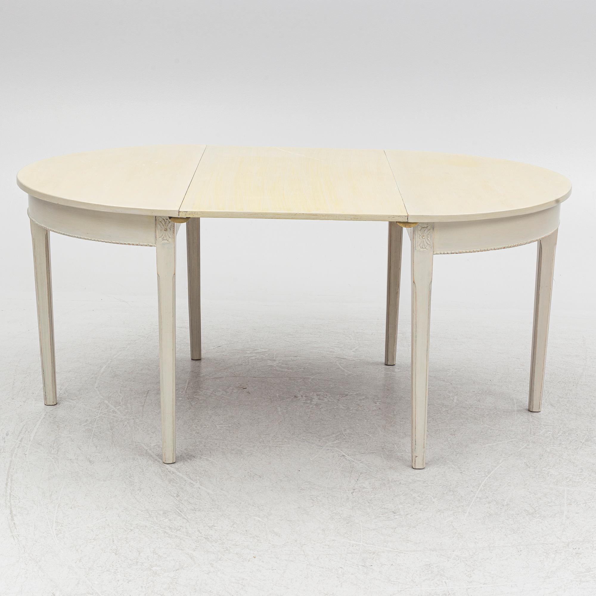 A Gustaivan style dining table/ two crescent shaped tables, end of the 19th century.