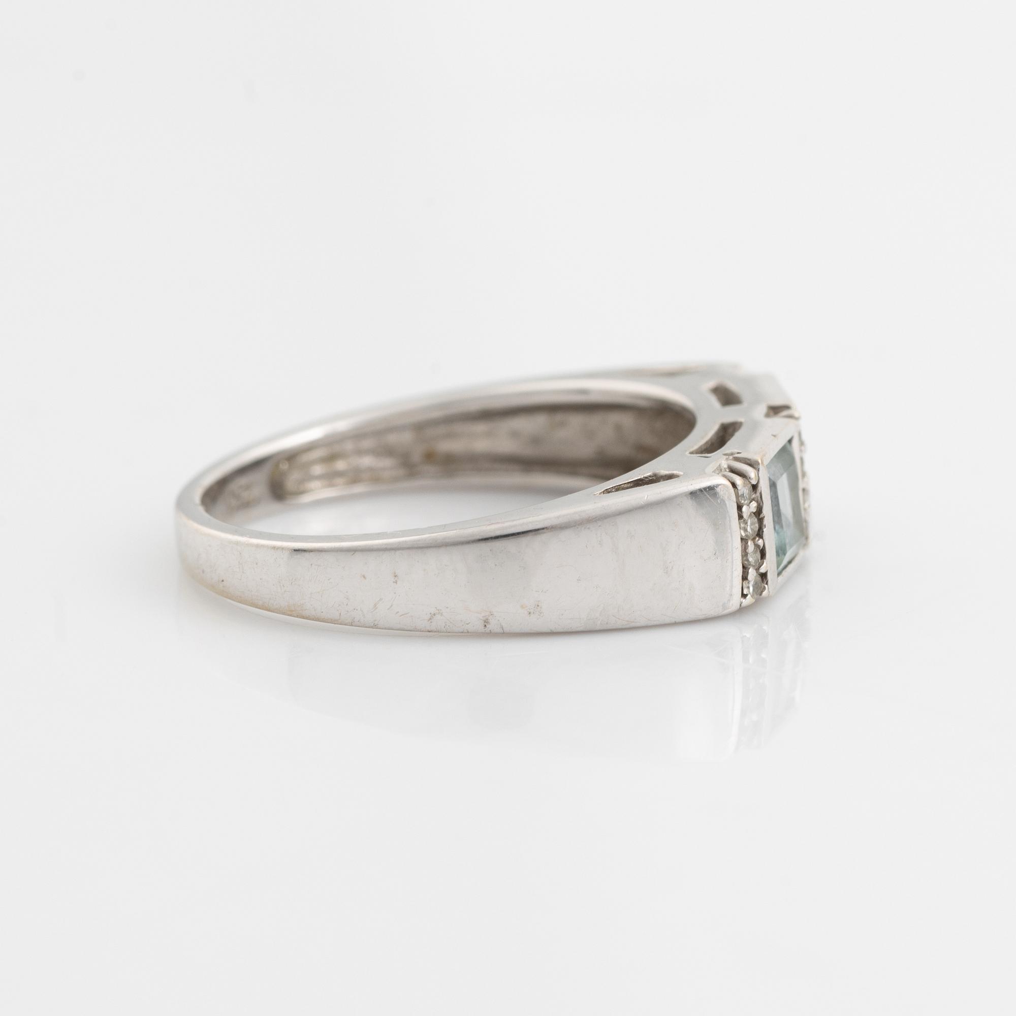 Ring, pendant, and a pair of earrings, 18K white gold with topaz and small diamonds.