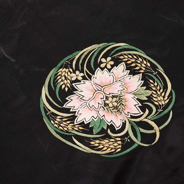 A Chinese embroidered silk robe, height 68 cm, 1920s.