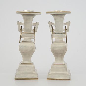 A pair of Chinese pewter and brass altar pieces, late Qing dynasty.